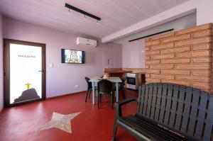 a living room with a table and a star on the floor at Casa de Peter in Cafayate