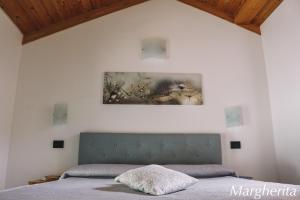 Ένα ή περισσότερα κρεβάτια σε δωμάτιο στο Case Vacanze Paola