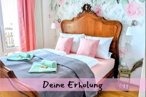 a bedroom with a bed with two towels on it at Queen Apartment in Uelzen