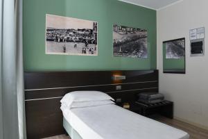 Posteľ alebo postele v izbe v ubytovaní Hotel Vienna
