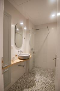 a bathroom with a sink and a mirror at Patio Apartment near metro & Acropolis in Athens