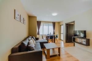 a living room with a couch and a table at Katerina Apartments 2 in Velingrad