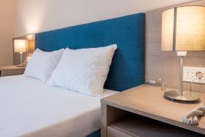 Postel nebo postele na pokoji v ubytování Garni Hotel MB