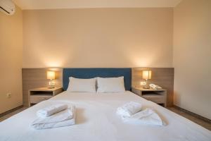 Postel nebo postele na pokoji v ubytování Garni Hotel MB