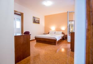 Postel nebo postele na pokoji v ubytování Garni Hotel MB
