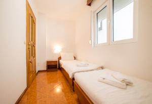 Postel nebo postele na pokoji v ubytování Garni Hotel MB