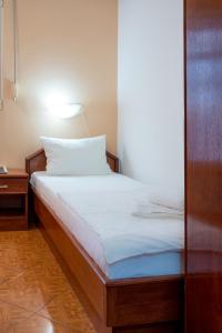 Postel nebo postele na pokoji v ubytování Garni Hotel MB