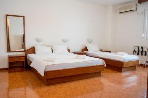 Postel nebo postele na pokoji v ubytování Garni Hotel MB