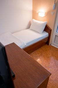 Postel nebo postele na pokoji v ubytování Garni Hotel MB