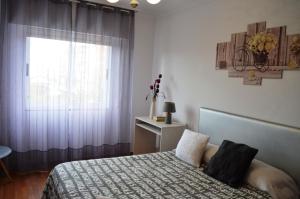 Posteľ alebo postele v izbe v ubytovaní REGO DA RAÑA APARTMENTS