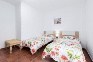 A bed or beds in a room at La flor del Atlantico