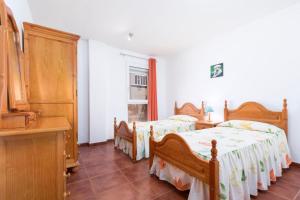 A bed or beds in a room at La flor del Atlantico