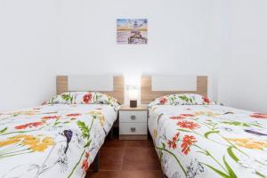 A bed or beds in a room at La flor del Atlantico Még 37 kép