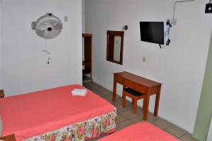 Postel nebo postele na pokoji v ubytování Orquídeas Hotel