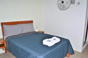 Postel nebo postele na pokoji v ubytování Orquídeas Hotel