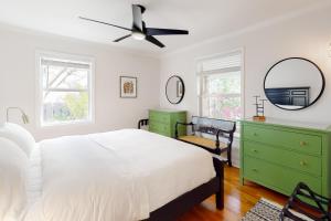 a bedroom with a bed and a ceiling fan at Northwood Charmer in West Palm Beach