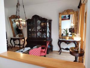 a room with a china cabinet and a mirror at Main Square View in Kotor +37 photos