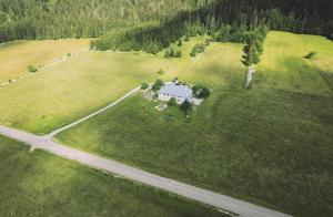 an aerial view of a house in a field at La Fessette in Chapelle-des-Bois