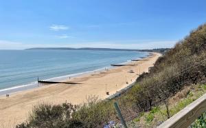 a view of a beach with people on it at The Winter Dene in Bournemouth