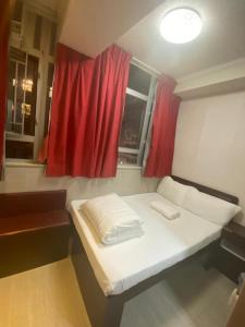 Voodi või voodid majutusasutuse 富都賓館 Fu Dou Guest House toas