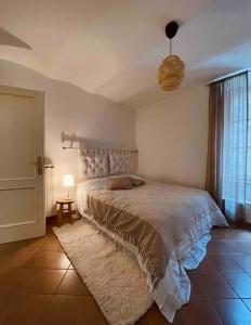 a bedroom with a large bed and a window at Una perla in pieno centro in Perugia