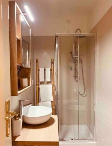 a bathroom with a sink and a shower at Una perla in pieno centro in Perugia