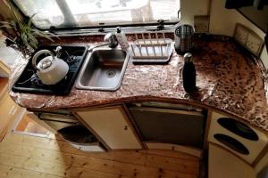 an overhead view of a kitchen with a sink at Truck & Pod creative nature retreat. in Bantry