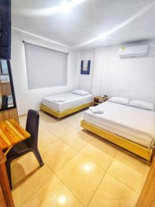 Postel nebo postele na pokoji v ubytování Hotel Palermo Sincelejo + 12 fotografií