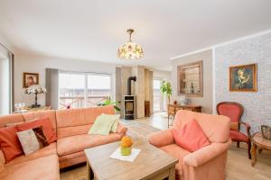 a living room with a couch and a table at Residence in Mariánské Lázně