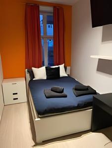 a bedroom with a bed with towels on it at 4 bedroom flat in the heart of Oslo in Oslo