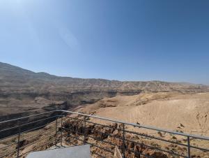 a view of the grand canyon from the top of a viewing platform at Alhidan Hostel & adventure in Madaba
