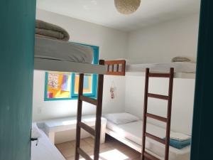 Postel nebo postele na pokoji v ubytování Morada Bromélias praia da Ferrugem