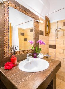 a bathroom with a sink and a mirror at Villa Uliana Kassandra Greece in Afitos