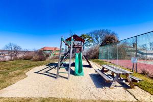 a playground with a slide and a bench at The Lookout #210 in Ogunquit