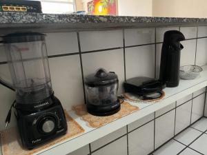 a blender sitting on a counter in a kitchen at Apartamento Beira Praia in Fortaleza