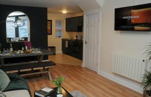 a living room with a couch and a dining room at 4 Tom's Lane in Bantry