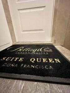 a welcome mat in front of a door at Bellagio Luxury Suites Apartments in Bellagio