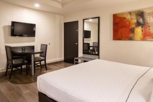 TV a/nebo společenská místnost v ubytování Hotel Astor Tijuana