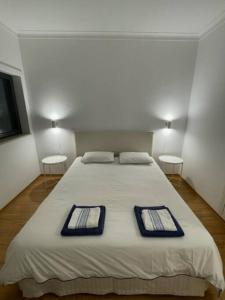 En eller flere senge i et værelse på Apartamento em frente à Praia