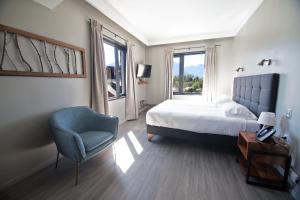 Rúm í herbergi á Hotel Enjoy Pucón
