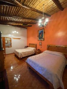 Postel nebo postele na pokoji v ubytování HOTEL El INDIO