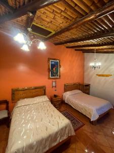 Postel nebo postele na pokoji v ubytování HOTEL El INDIO