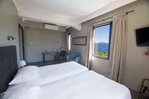 Rúm í herbergi á Hotel Enjoy Pucón