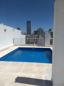 a swimming pool on the roof of a building at Recoleta 2 amb in Buenos Aires