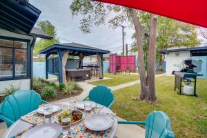 a table and chairs in a yard with a grill at San Antonio Vacation Rental about 7 Mi to River Walk! in San Antonio