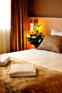 Postel nebo postele na pokoji v ubytování Starton Hotel