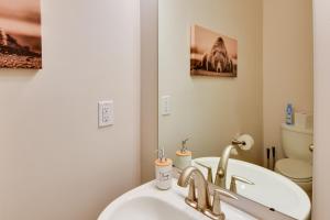 a bathroom with a sink and a toilet and a mirror at Private Hot Tub Heber City Gem 15 Mi to Park City in Heber City +29 photos