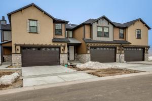 a house with two garage doors on a street at Private Hot Tub Heber City Gem 15 Mi to Park City in Heber City