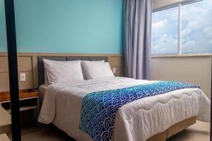 Un ou plusieurs lits dans un hébergement de l'établissement Aqualand Resort Salinópolis