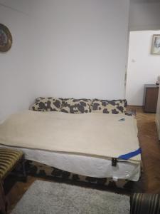 Postel nebo postele na pokoji v ubytování Kraljevski apartman